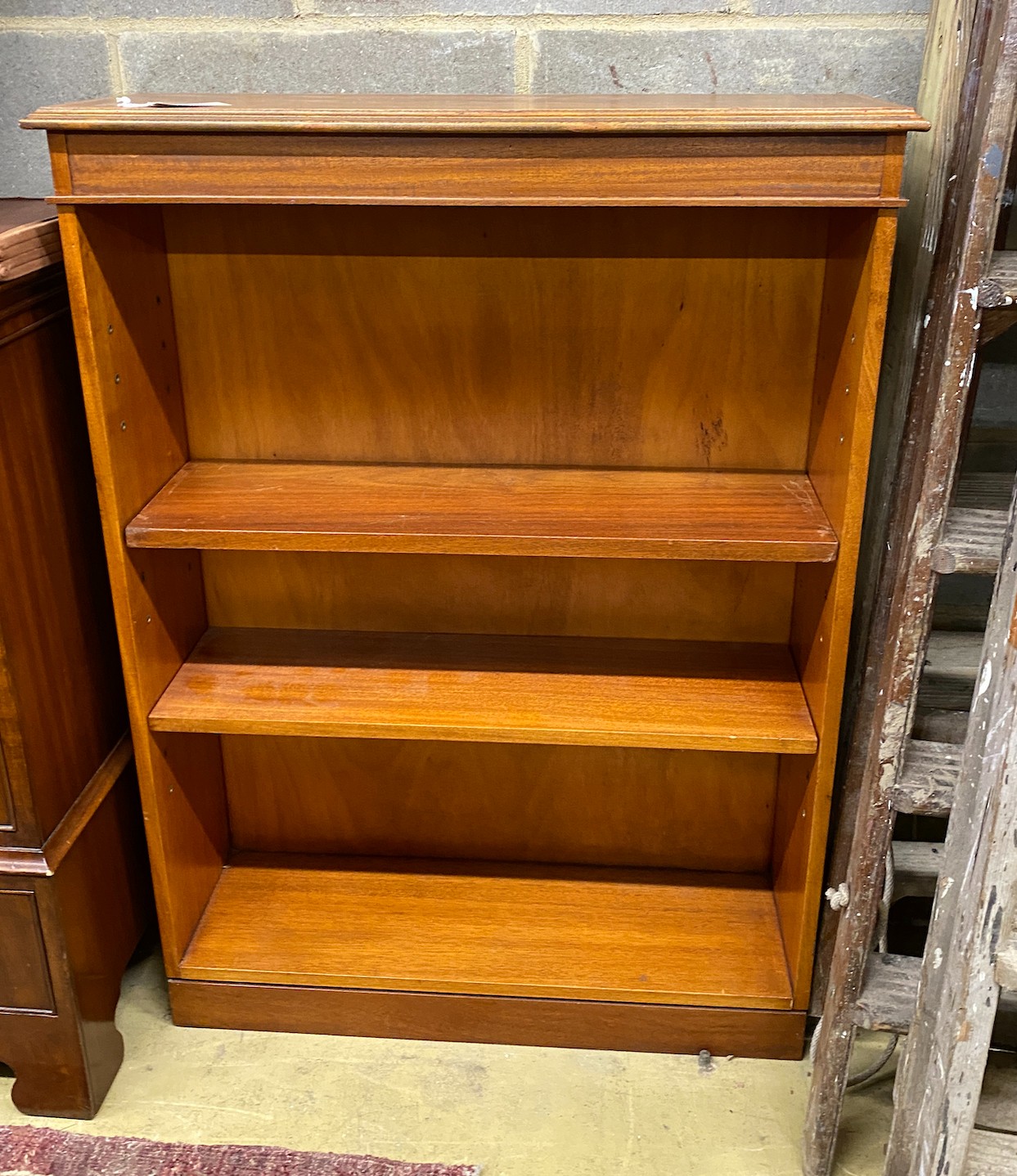 A reproduction Edwardian style mahogany open bookcase, width 79cm, depth 26cm, height 107cm
